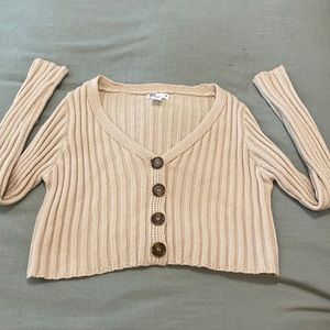 Cropped, ceam/tan colored cardigan.